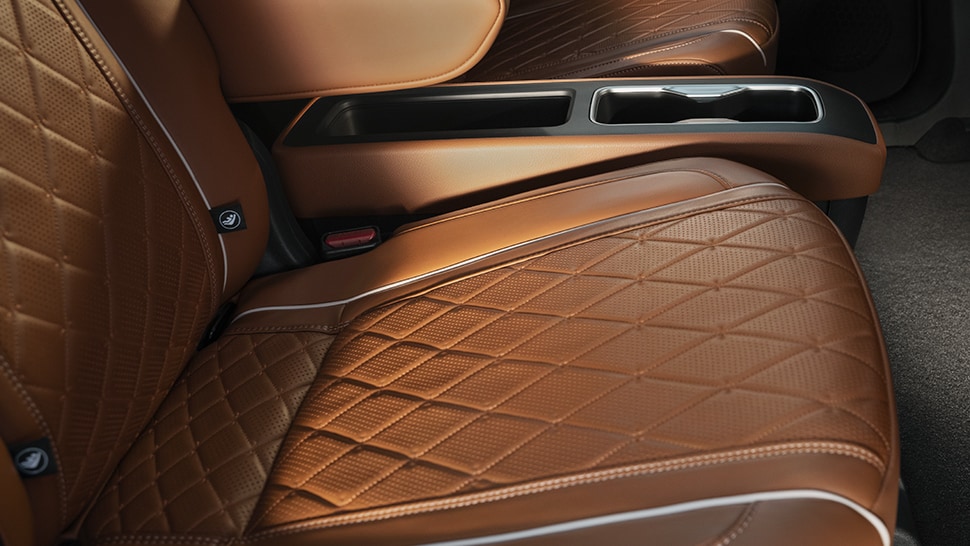 Interior view of the 2024 INFINITI QX60 highlighting quilted leather seats