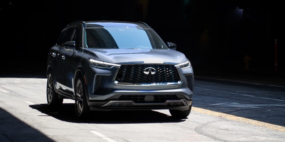 Front profile of 2024 INFINITI QX60 Crossover SUV on street